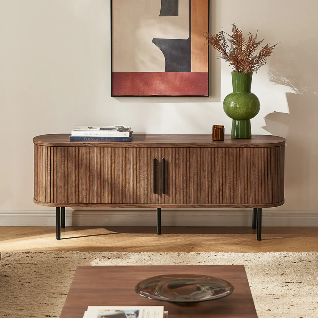 Dark Walnut Sideboard With Black Metal Legs in a living room with decor items on top