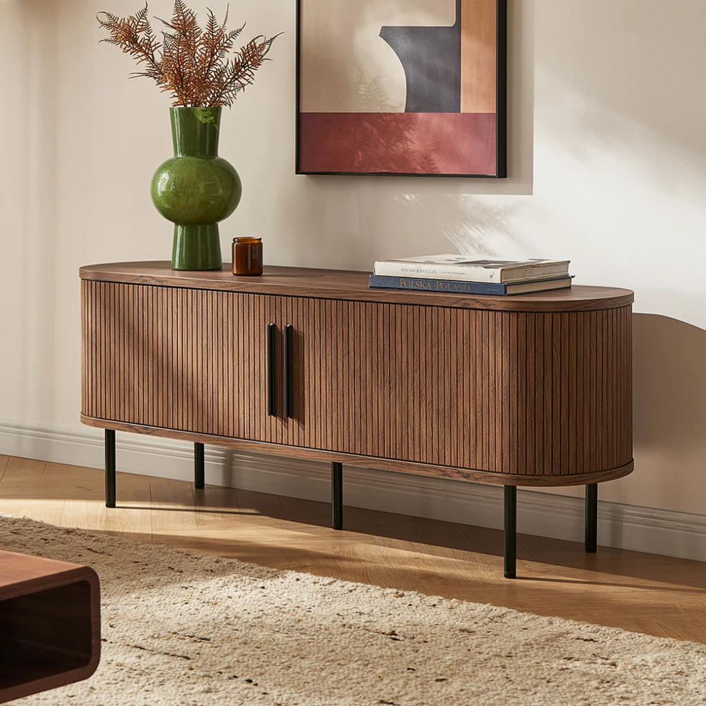 Dark Walnut Sideboard With Black Metal Legs with decorative items in a living room setting