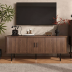 Dark Walnut Sideboard With Black Metal Legs with decorative items against a wall with a television.