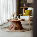 Wooden coffee table with decorative items in a living room setting