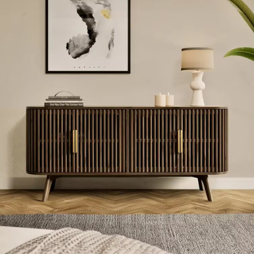 Wooden sideboard in a living room with decor items on top