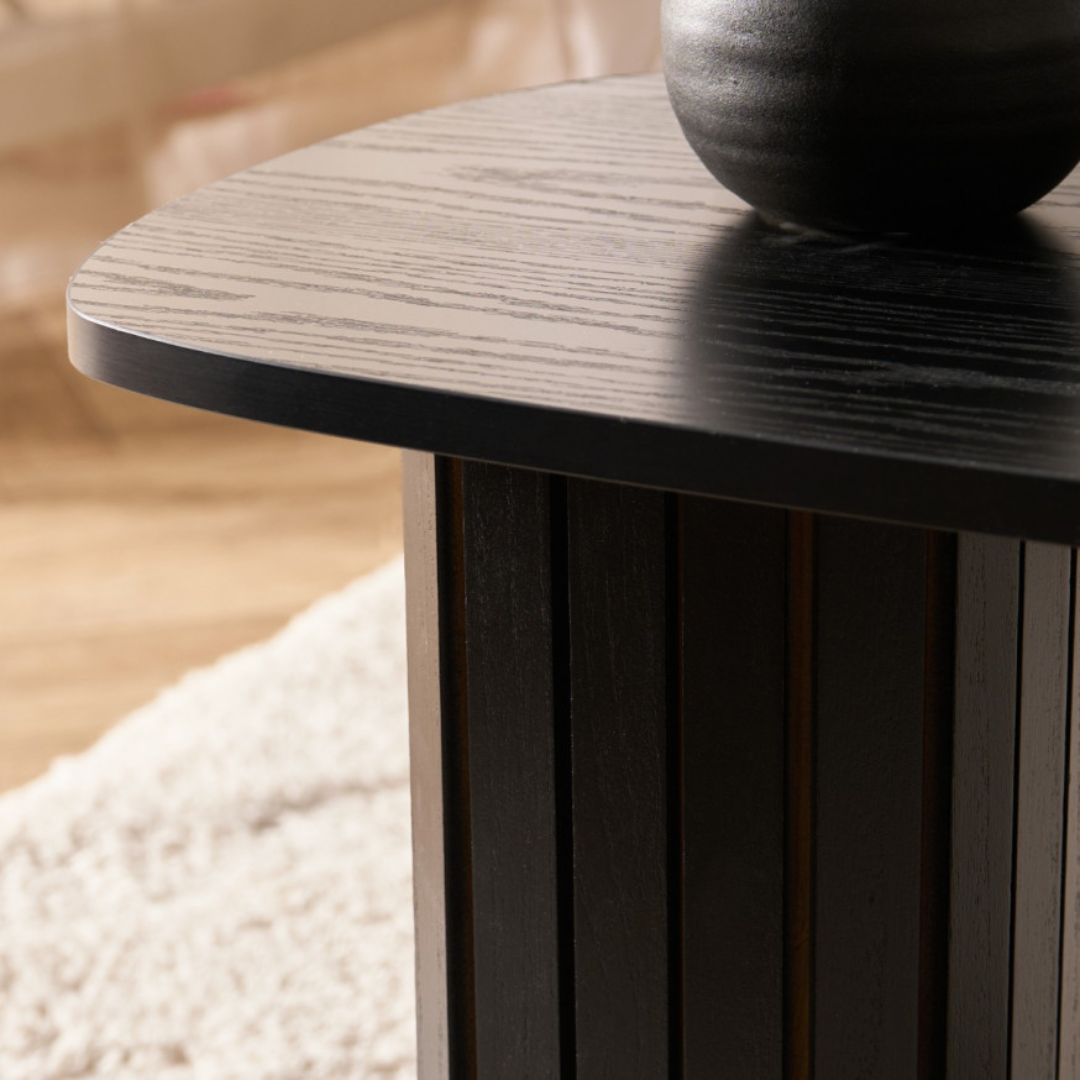 Close-up of a Black Ribbed Oval Coffee Table
