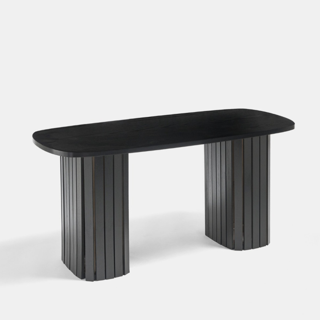 Black Ribbed Oval Coffee Table with unique cylindrical legs on a white background