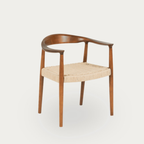 Wooden chair with woven seat on a white background