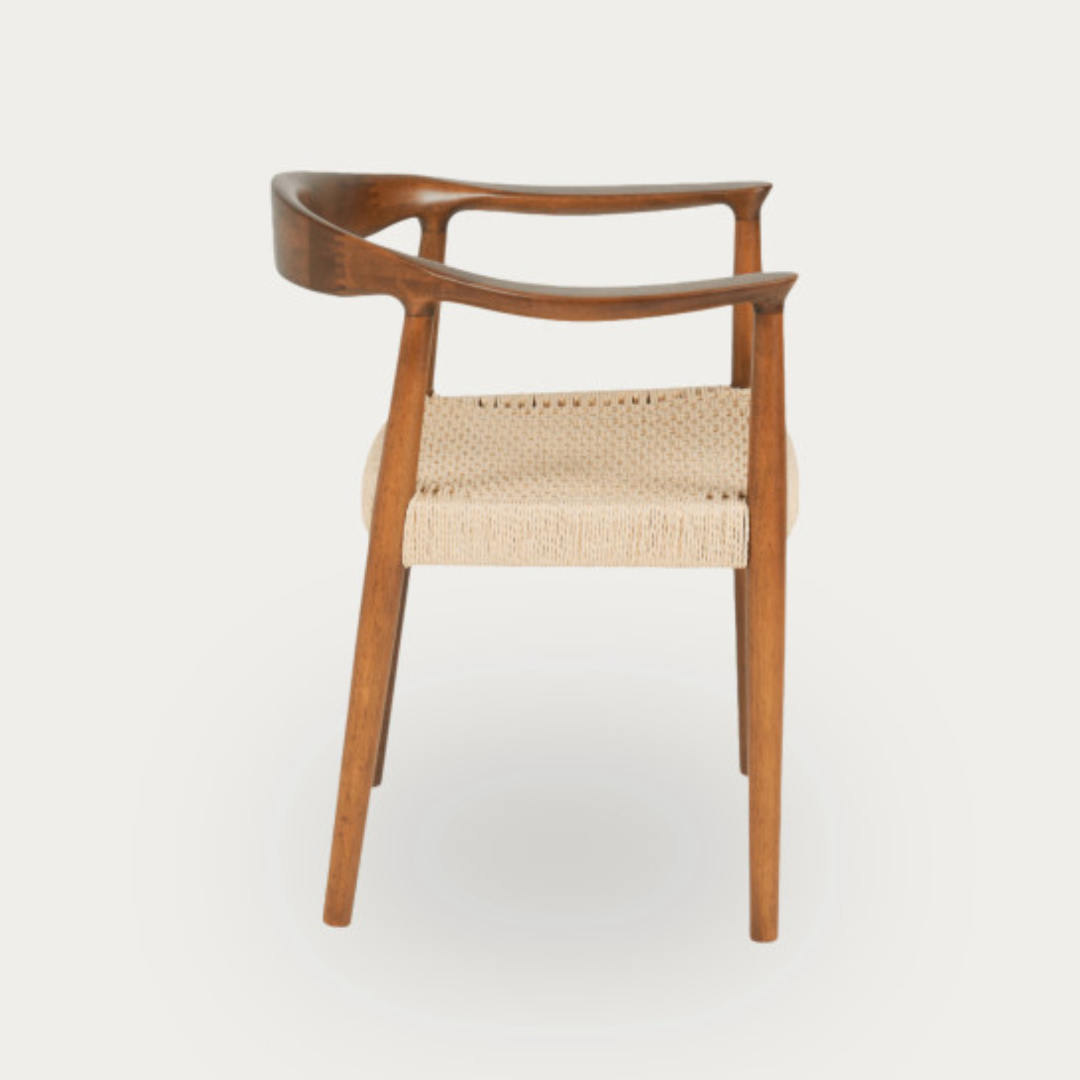 Wooden chair with woven seat on a white background