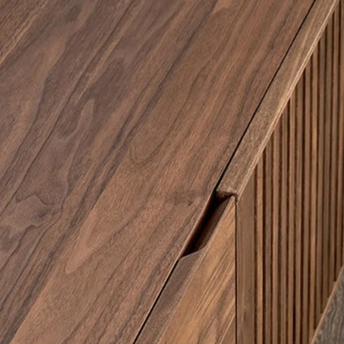 Close-up of a wooden cabinet with a focus on the grain and texture.