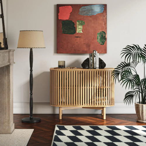 Living room with Oak Slatted Sideboard, lamp, and abstract painting