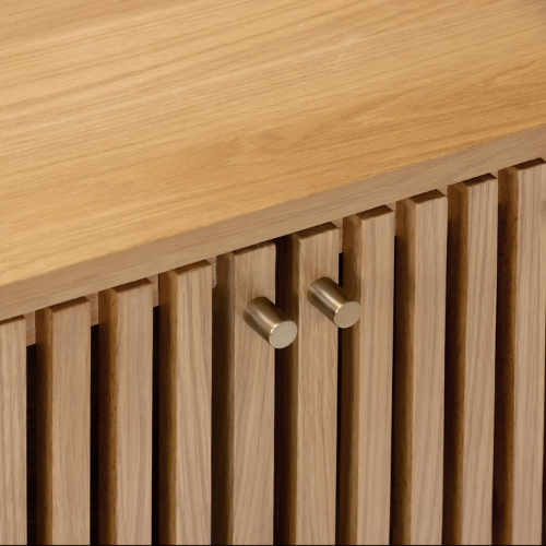 Wooden surface with slatted design and gold hooks