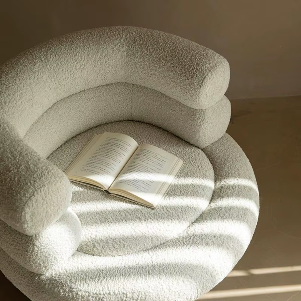 close up of the boucle fabric and curved chair design