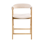 A modern wooden chair with a cream-colored textured sheepskin or boucle upholstered seat and curved backrest, set against a solid white background.