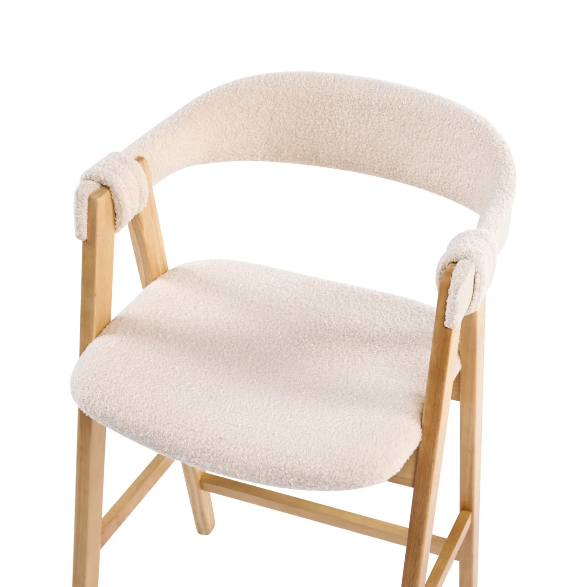 A wooden dining chair with a plush cream-colored bouclé seat cushion and matching curved backrest, featuring knotted armrest details, shown against a solid white background.