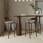 Dining area with wooden table and two Wooden Bar Stools with Grey Fabric Seat