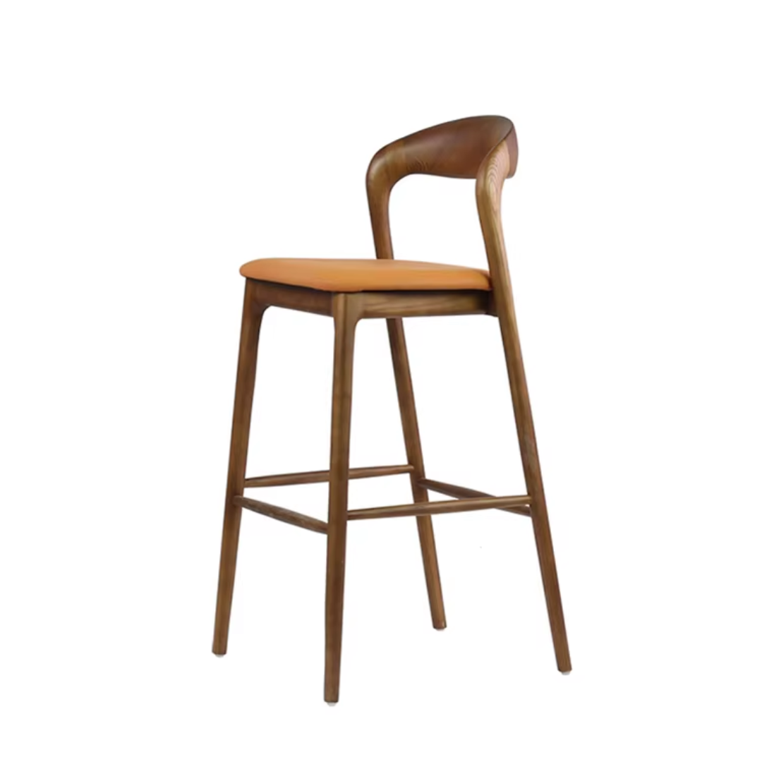 Wooden bar stool with a orange cushioned seat on a white background
