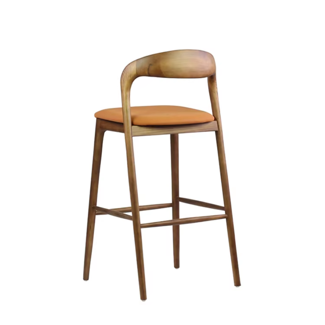 Wooden bar stool with an orange cushion on a white background