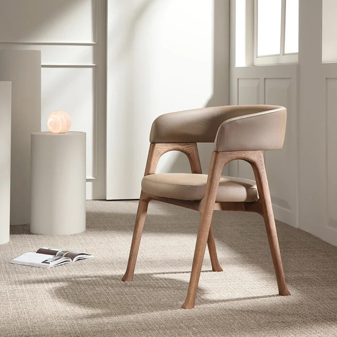 side view of the Beige Leather Dining Chair in a modern interior setting