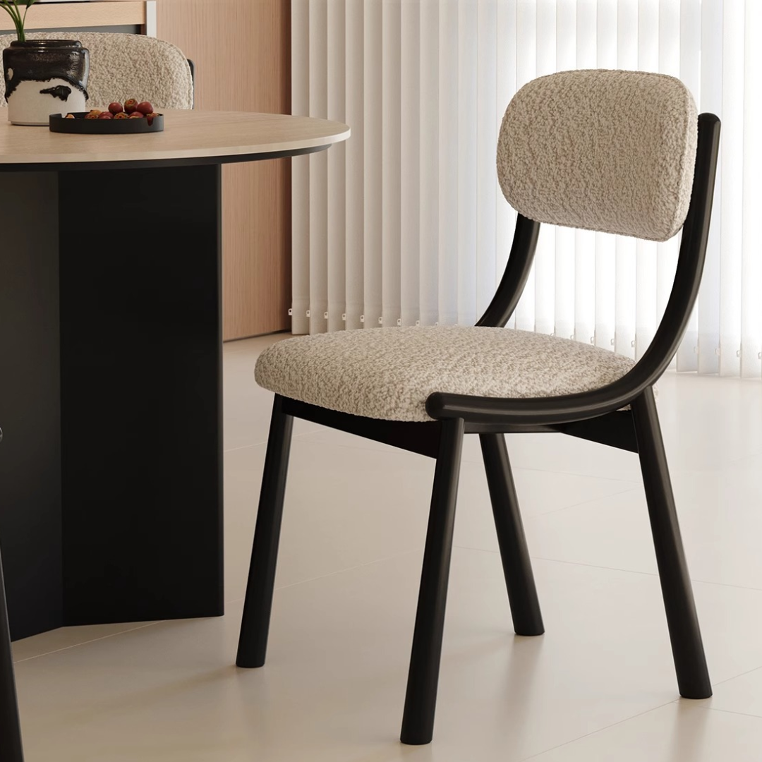 Black Metal And Boucle Fabric Dining Room Chair around a modern table