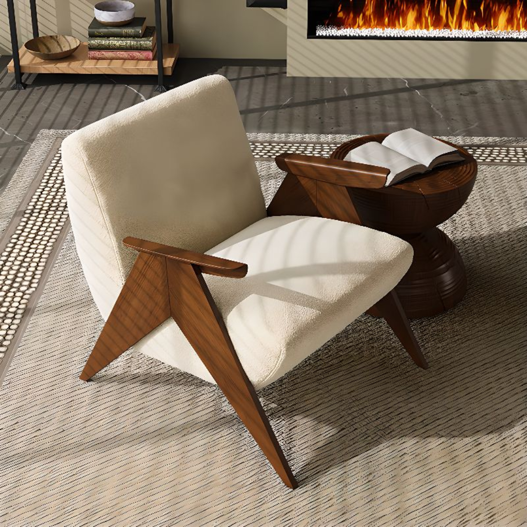 Beige armchair with wooden arms and legs in a living room setting with a fireplace.