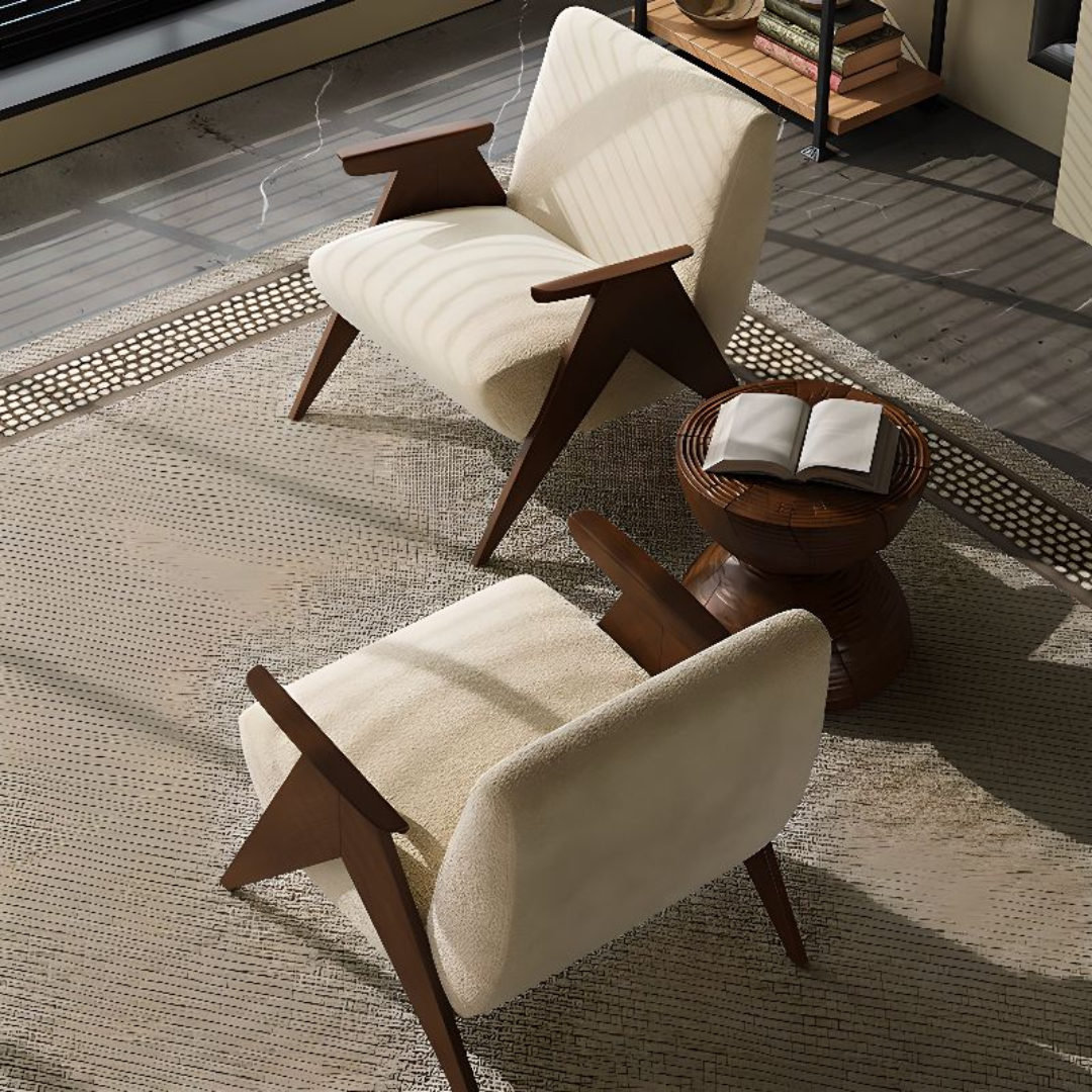 Two beige armchairs with wooden frames in a modern living room setting.