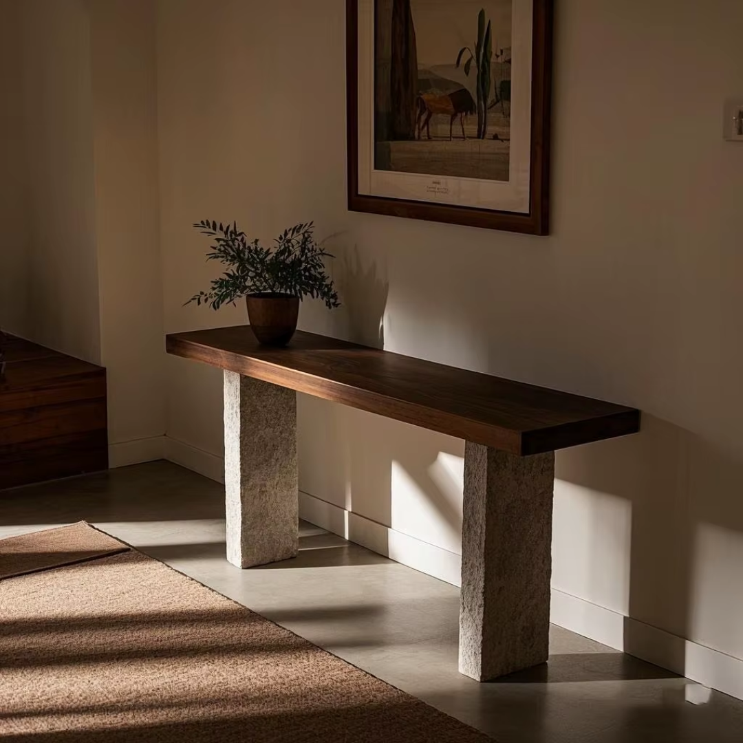 Walnut and Natural Stone Console Table in a room with a painting on the wall.