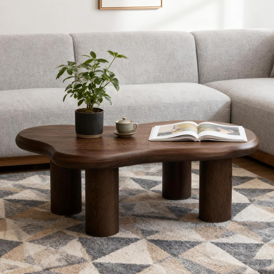 Dark Wood Coffee Table with a plant, cup, and book in a living room setting.