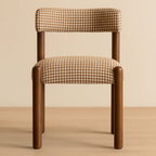 Chair with houndstooth patterned cushion on a beige background
