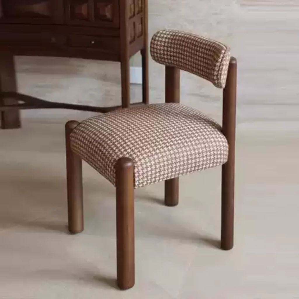 Chair with brown wooden frame and patterned cushion on a light wooden floor.