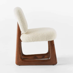 Neutral Boucle Dining Chair  with wooden frame and white cushioned seat on a white background