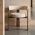 Cream Fabric And Oak Dining Chair with wooden frame and beige cushion against a textured wall.