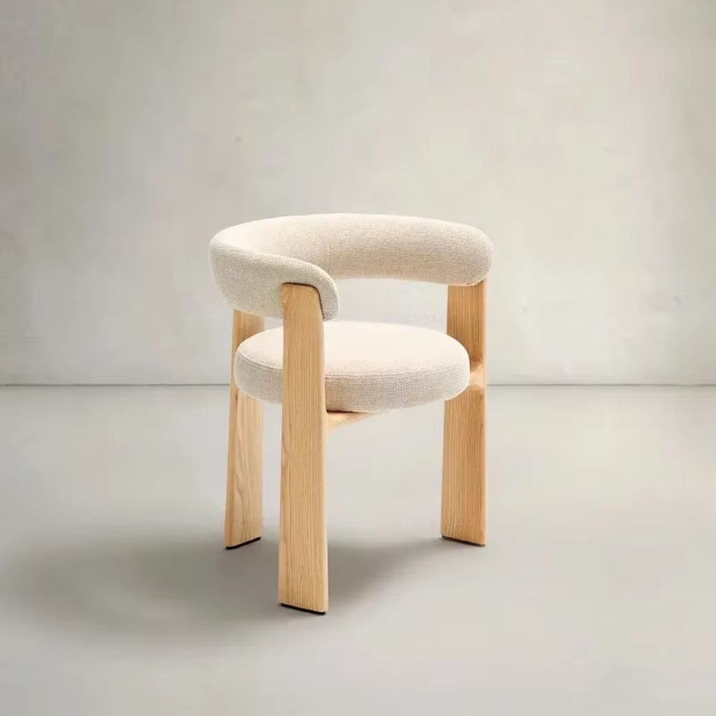 Chair with beige cushioned seat and backrest on a light gray background