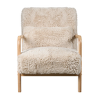 A modern armchair with a light natural wood frame and thick, fluffy cream-colored faux fur upholstery, shown against a plain white background.