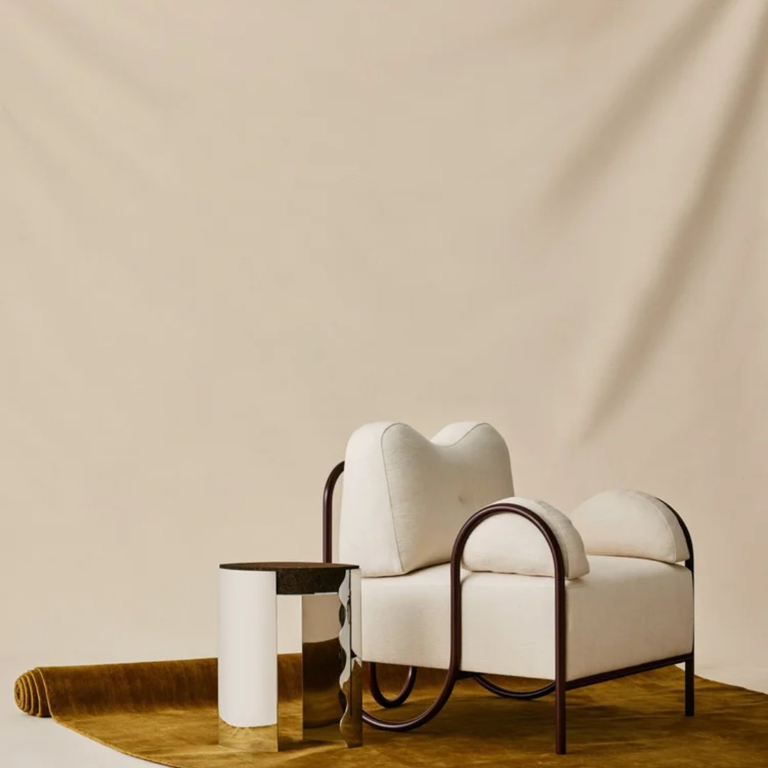 Beige Funky Occasional Chair with metal frame on a light background