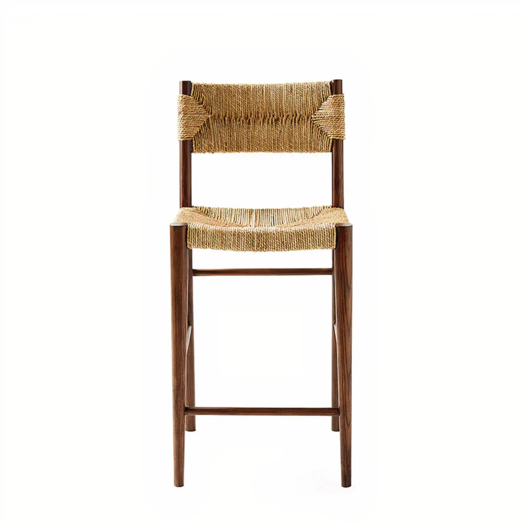 Wooden bar stool with woven seat and backrest on a white background