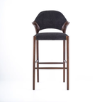 Bar stool with black cushioned seat and backrest on a white background