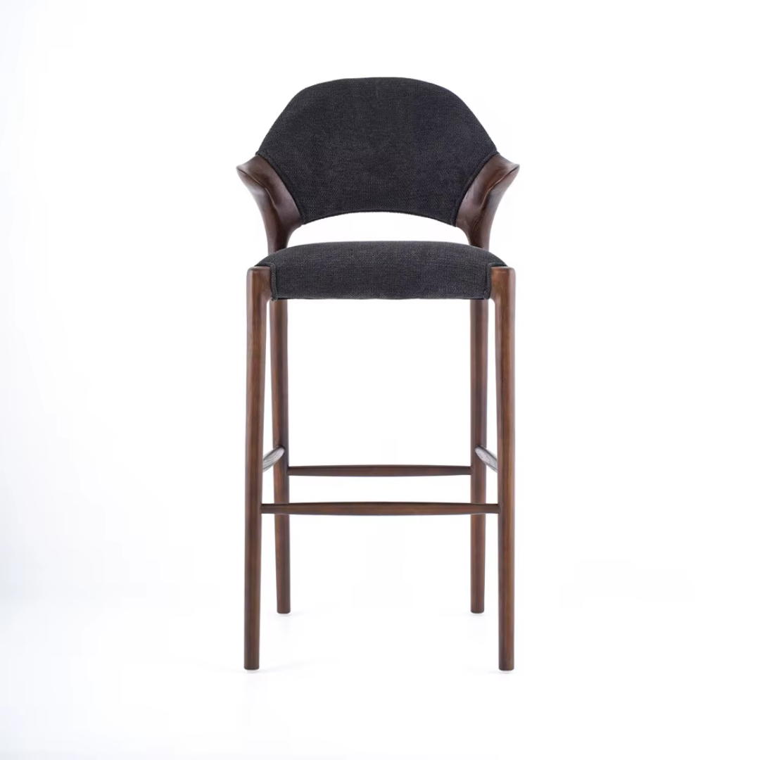 Bar stool with black cushioned seat and backrest on a white background