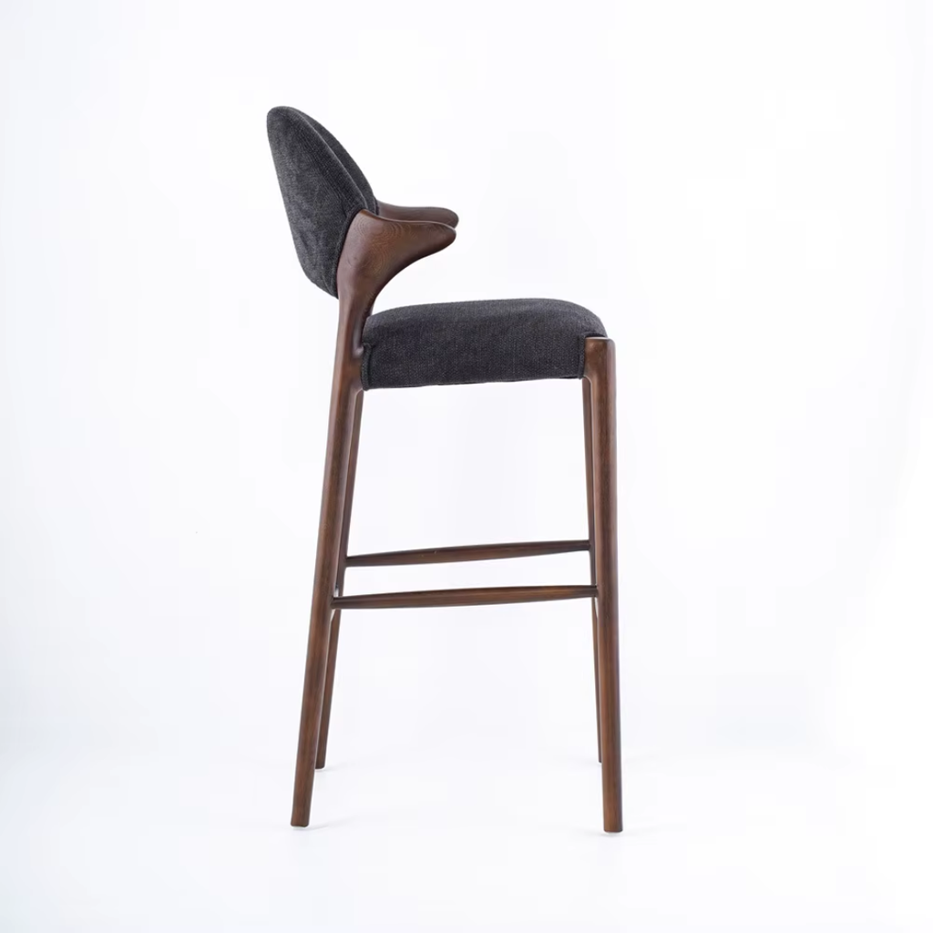 Bar stool with dark gray cushioned seat and backrest on a white background