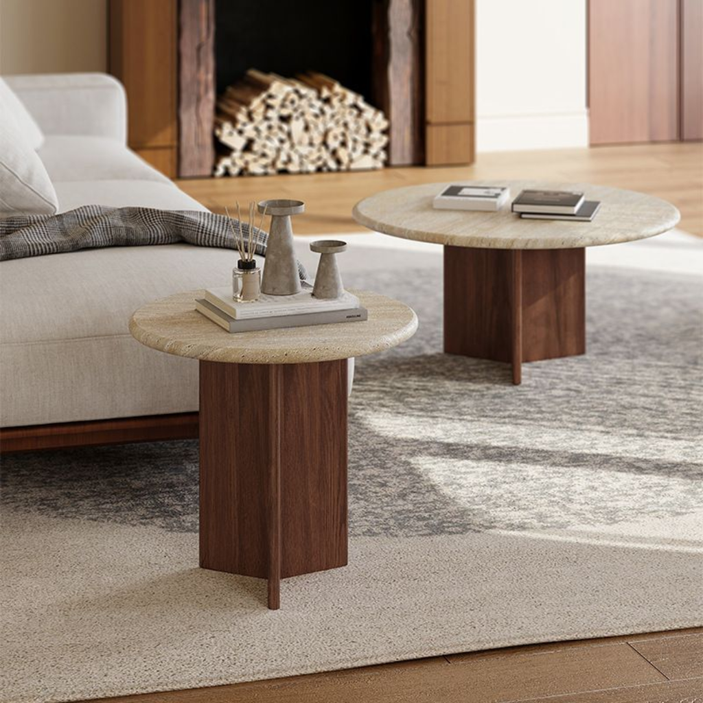 Two Round Travertine Coffee Tables with marble-like tops in a living room setting.