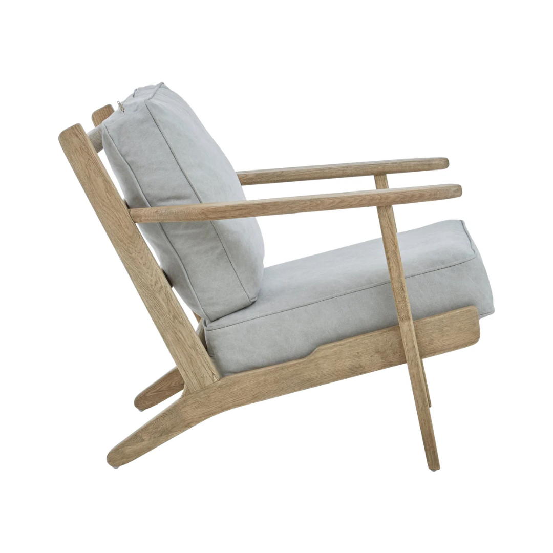 Modern chair with wooden frame and light gray cushion on a white background