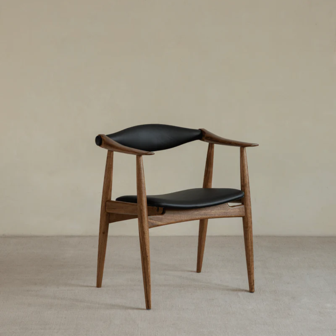 Wood And Black Leather Dining Chair and backrest on a beige background