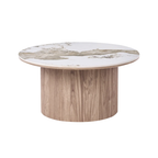 A round coffee table with a light oak wood pedestal base and a white marble top featuring natural gray and beige veining, shown on a solid white background.