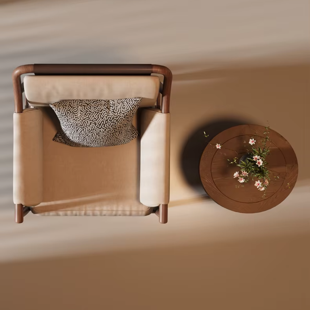 Beige armchair with wooden frame and small round table with plant on a beige background
