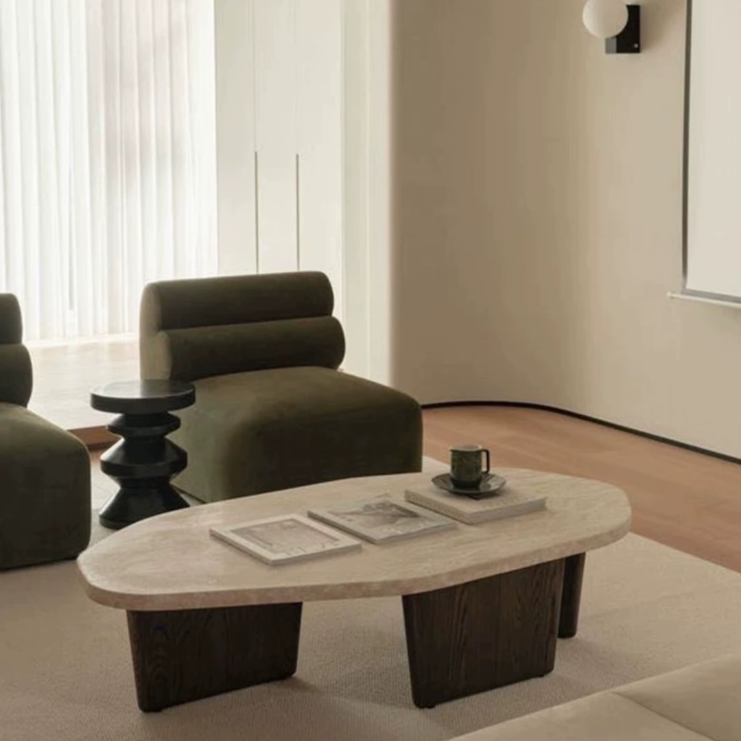 Modern living room with a Walnut Wood Round Travertine Coffee Table, armchair, and side table.