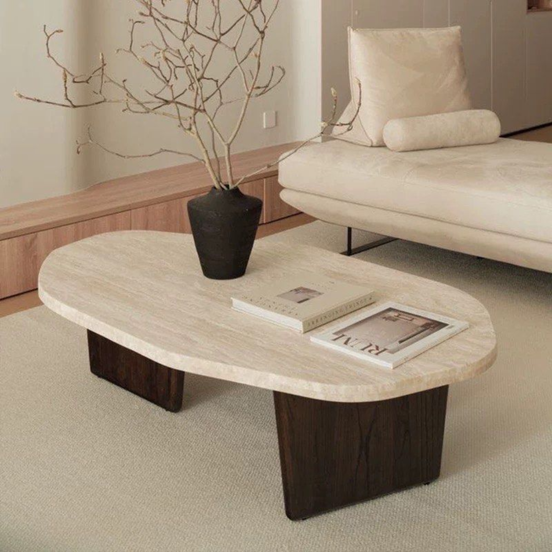 Walnut Wood Round Travertine Coffee Table with a vase and books in a living room setting