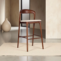 Wood And Cream Leather Bar Stool in a minimalistic setting.