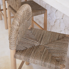 Woven chair with wooden legs on a light background
