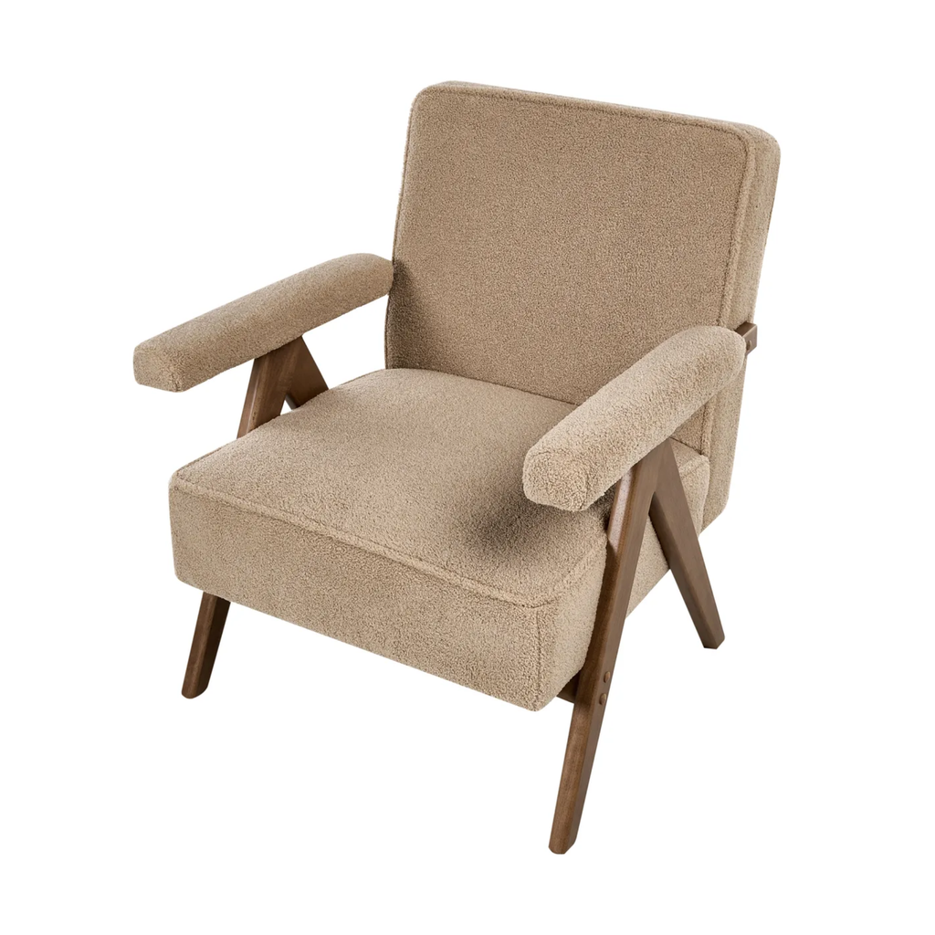 A mid-century modern accent chair with a textured beige bouclé fabric upholstery and angled dark brown wooden legs, shown on a solid white background.