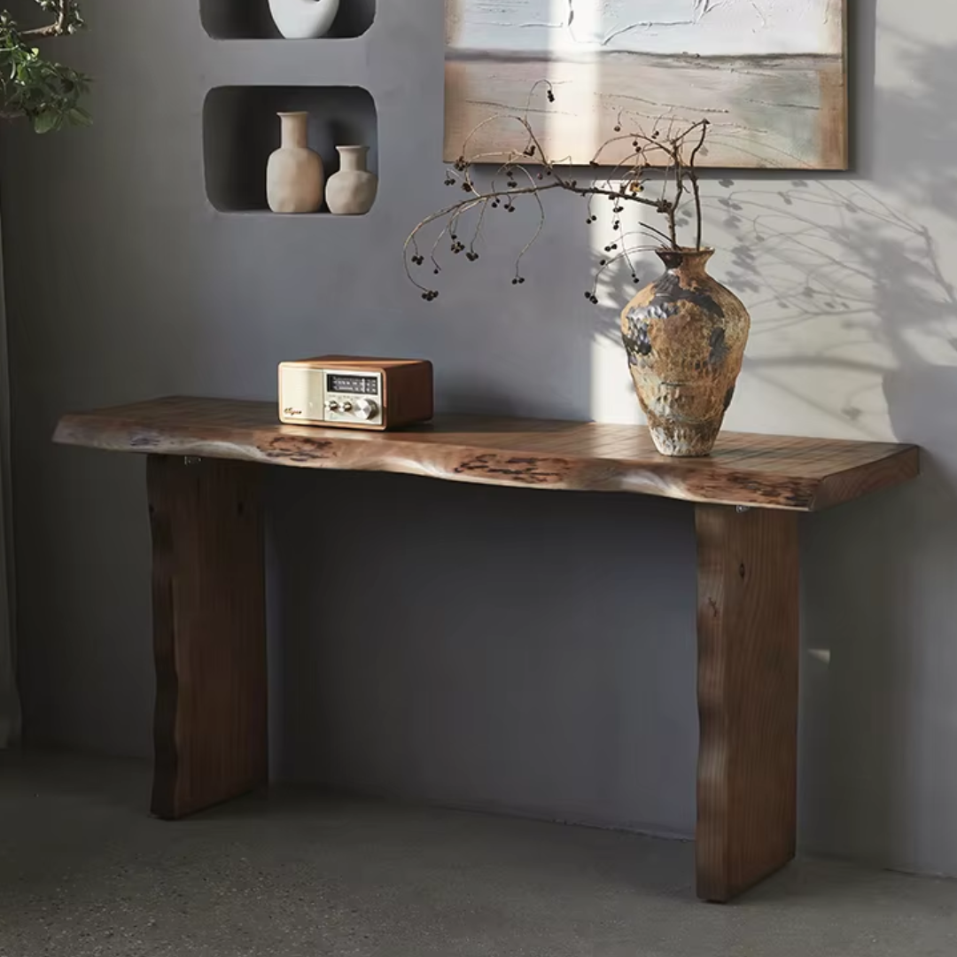 Rustic Chunky Wood Console Table with a radio and vase against a gray wall.