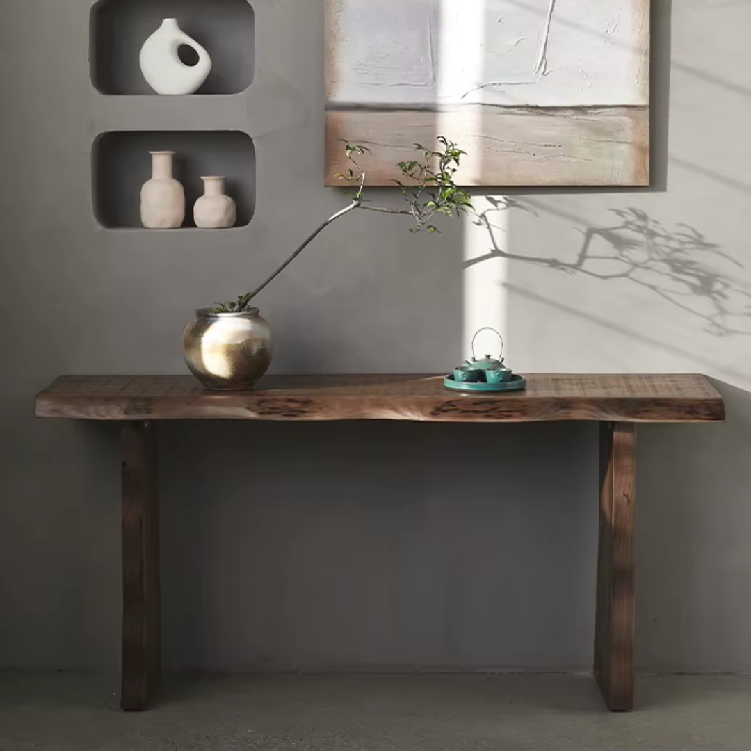 Rustic Chunky Wood Console Table with decorative items against a gray wall.