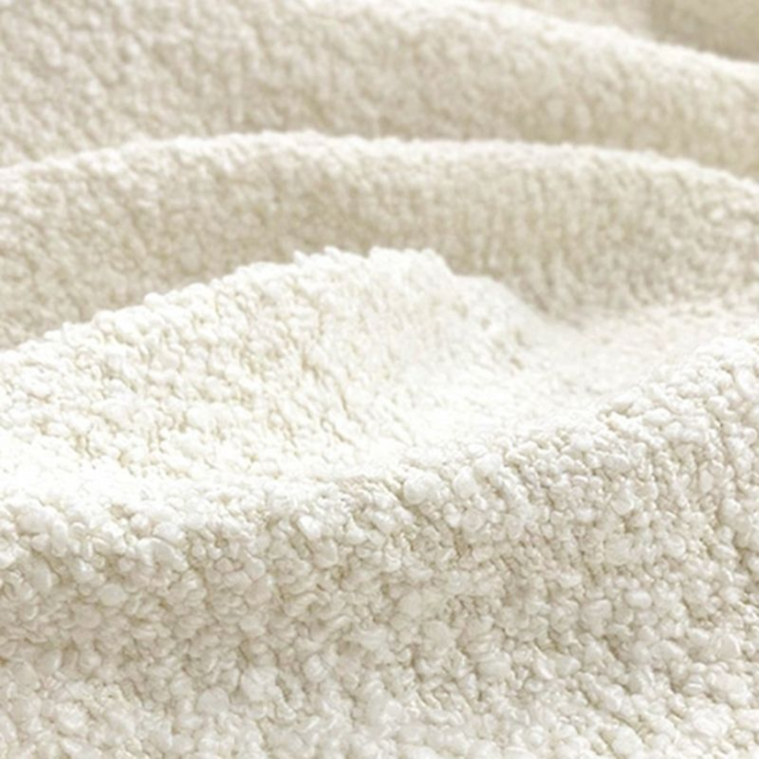 Close-up of a textured beige fabric surface