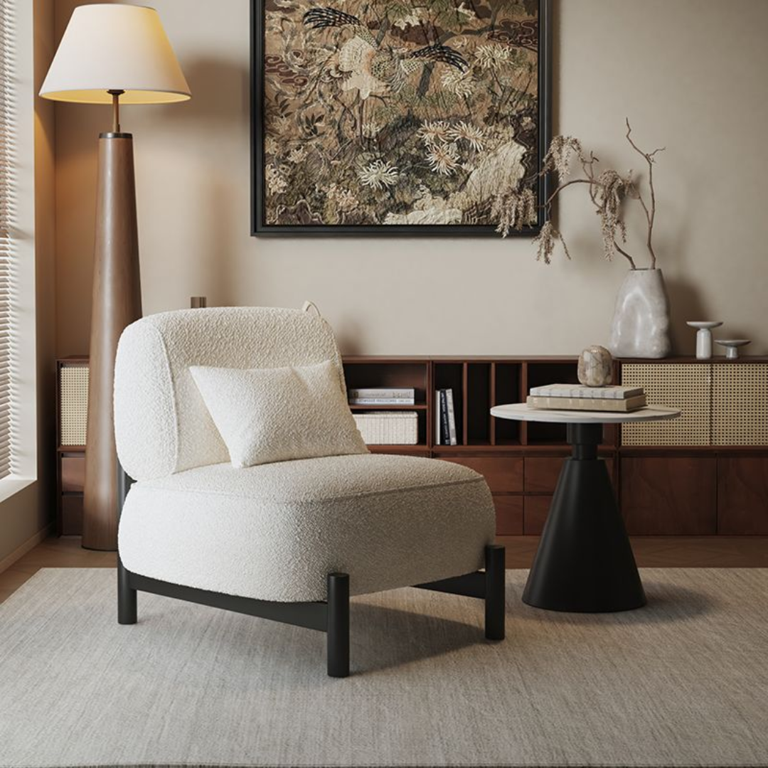 Modern living room with a White And Black Accent Chair , side table, and decorative elements.