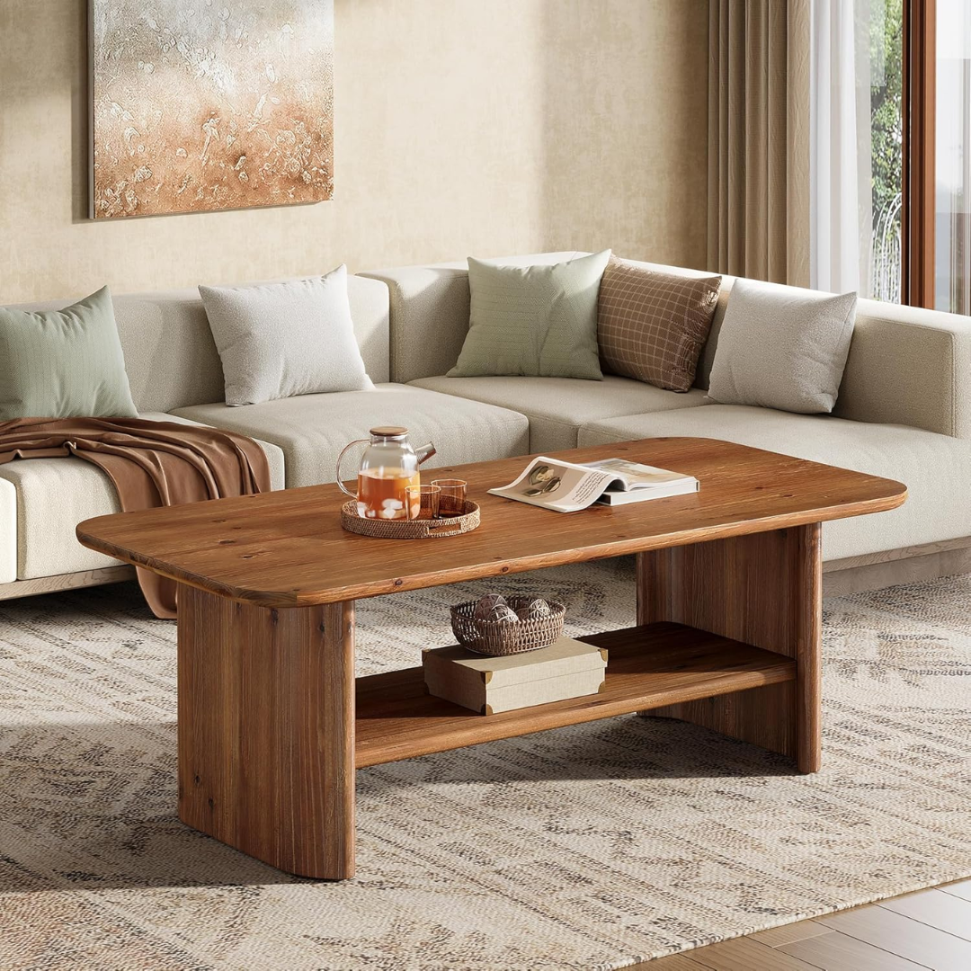 Solid Wood Large Rectangular Coffee table with a book and glass on it in front of a sectional sofa.